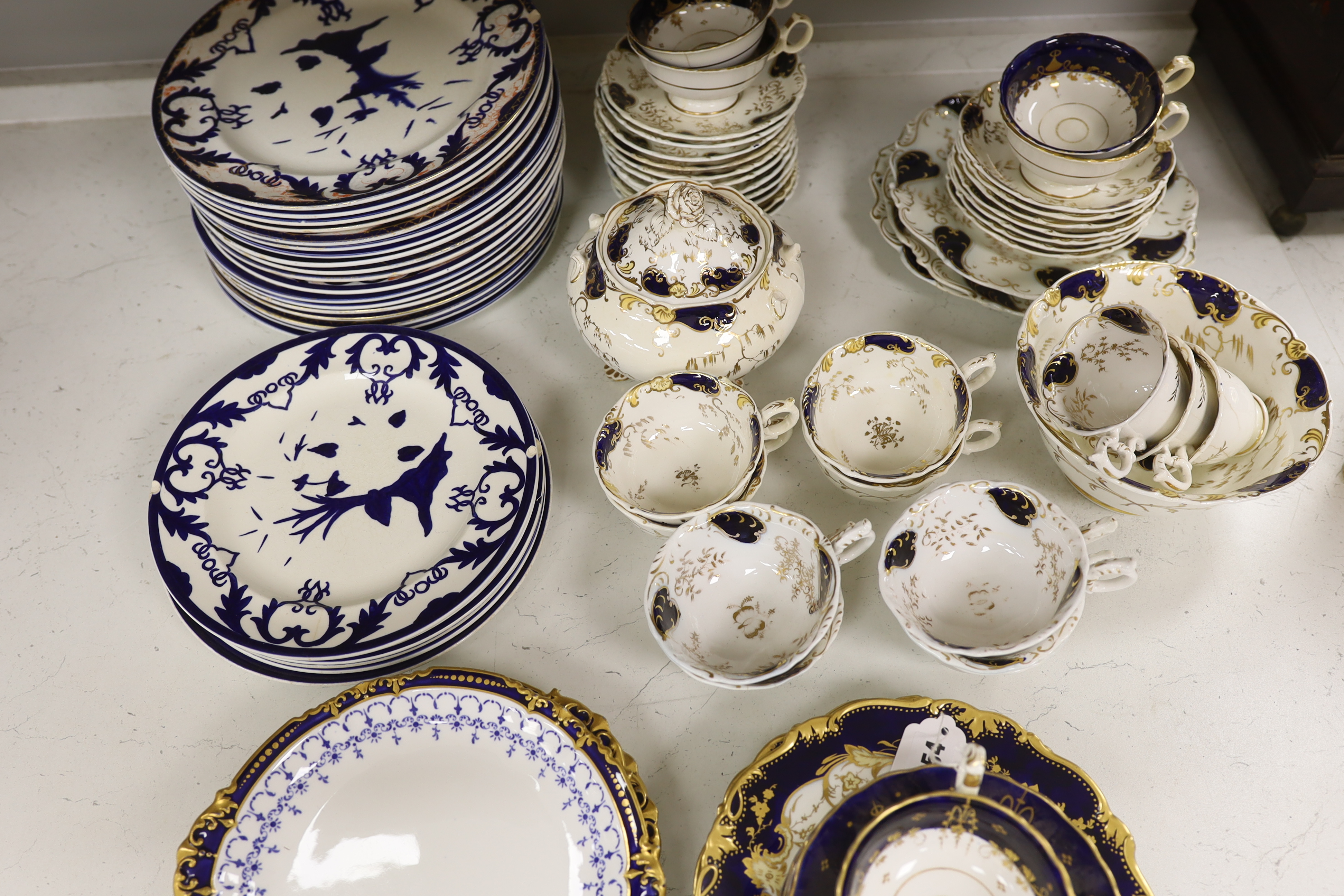 A Royal Crown Derby blue and gilt bordered part dessert service, together with a Victorian Staffordshire blue and gilt part tea service
